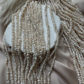 Жемчуг натуральный "Рис" плоский, 2*4 мм, 17 см нить